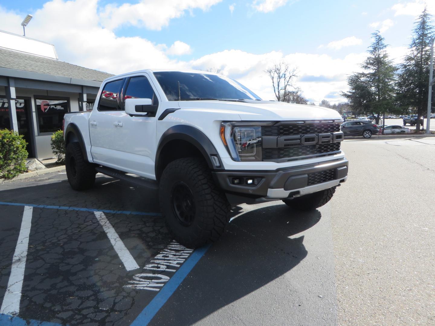 2023 White /BLACK Ford F-150 Raptor SuperCrew 4WD (1FTFW1RG6PF) with an 3.5 V6 engine, 6A transmission, located at 2630 Grass Valley Highway, Auburn, CA, 95603, (530) 508-5100, 38.937893, -121.095482 - Raptor sitting on Eibach front and rear springs, 37" Nitto Ridge Grappler tires, 17" Method NV wheels, and window tint. - Photo#2